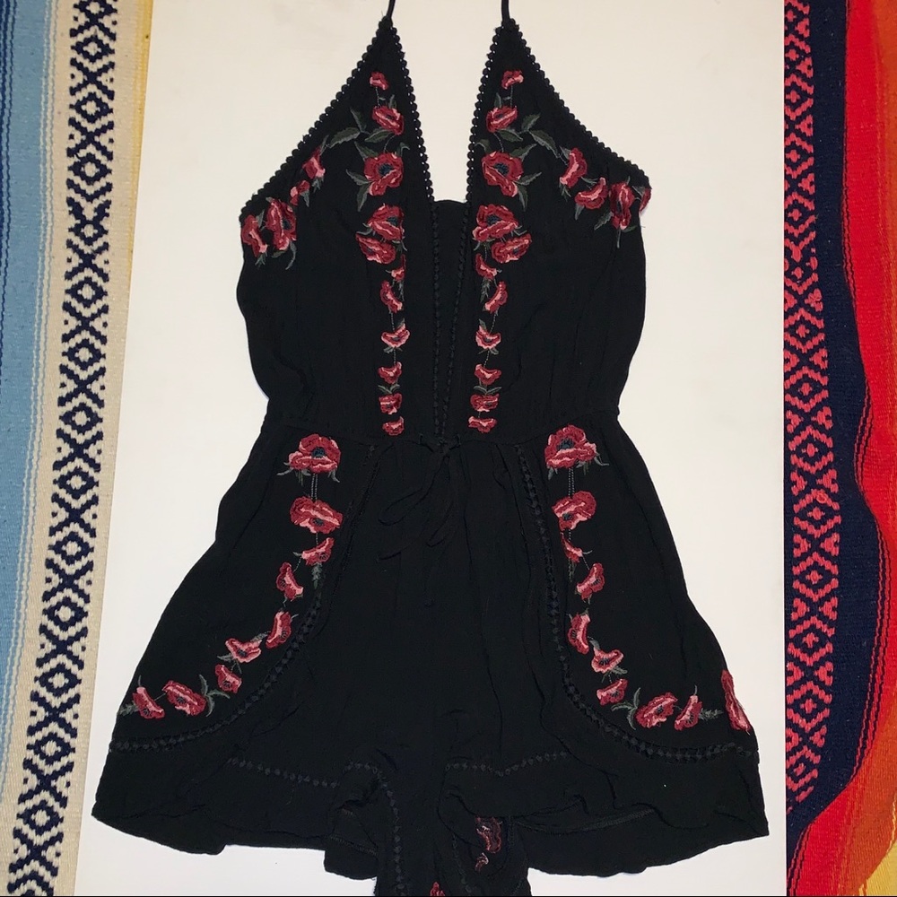 black romper with floral embroidery